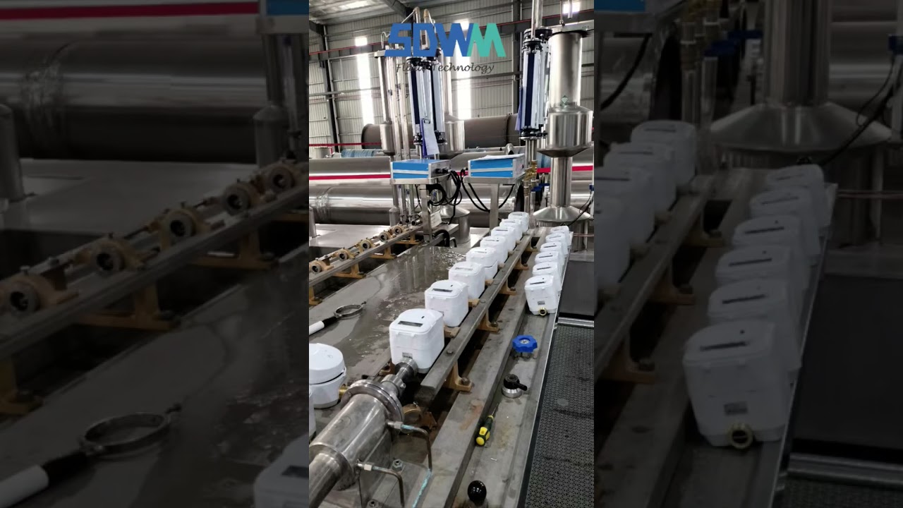 Ultrasonic water meter calibration and testing before packing.