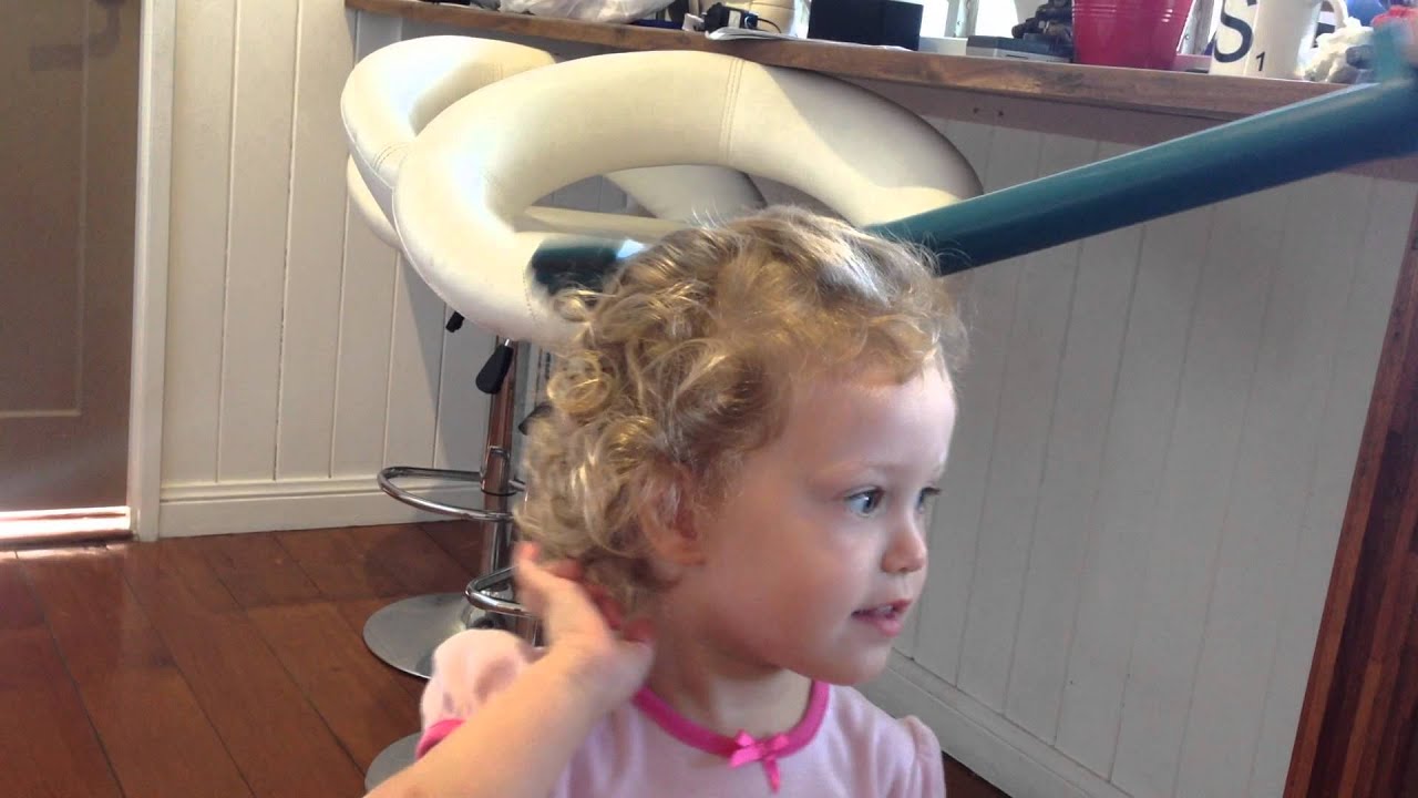 A dad's solution to doing his daughters hair before kindy when her hair is very curly.