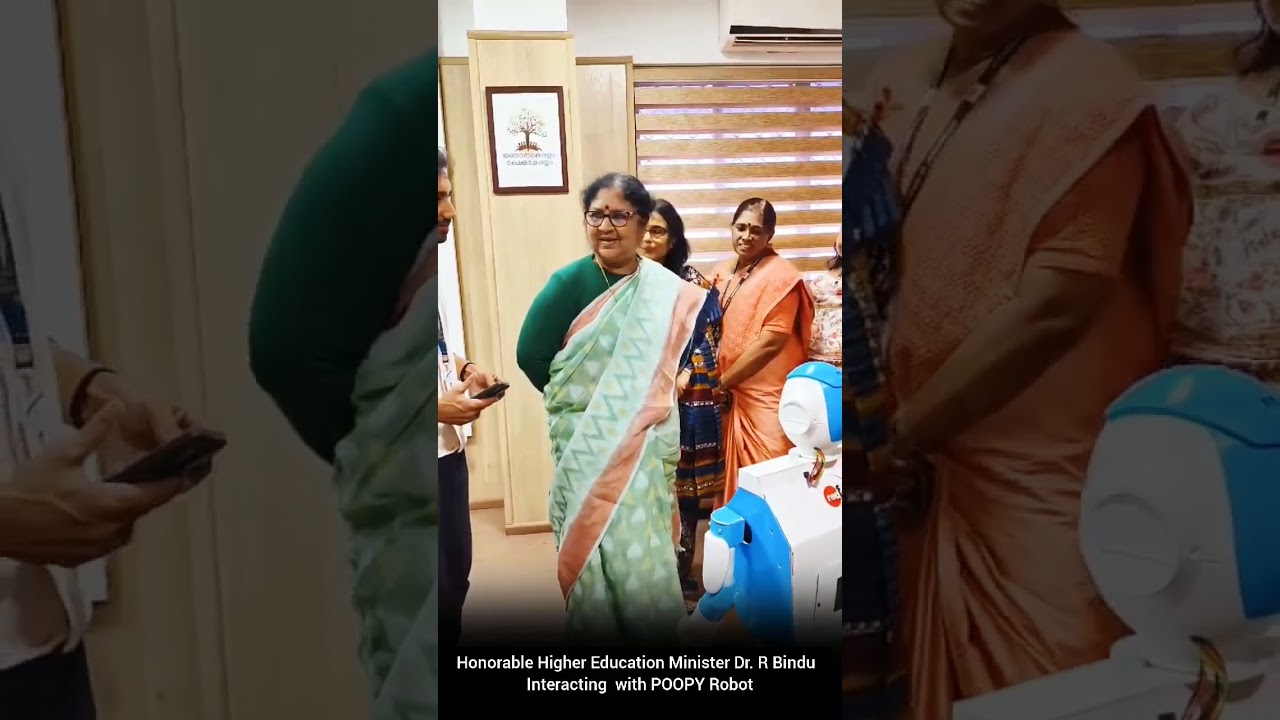 Minister Dr. R. Bindu Interacting with Poopy Robot