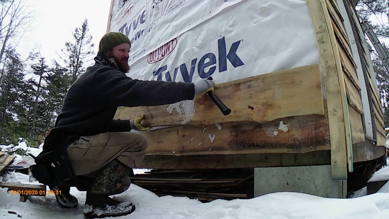 Off grid tiny cabin live edge siding