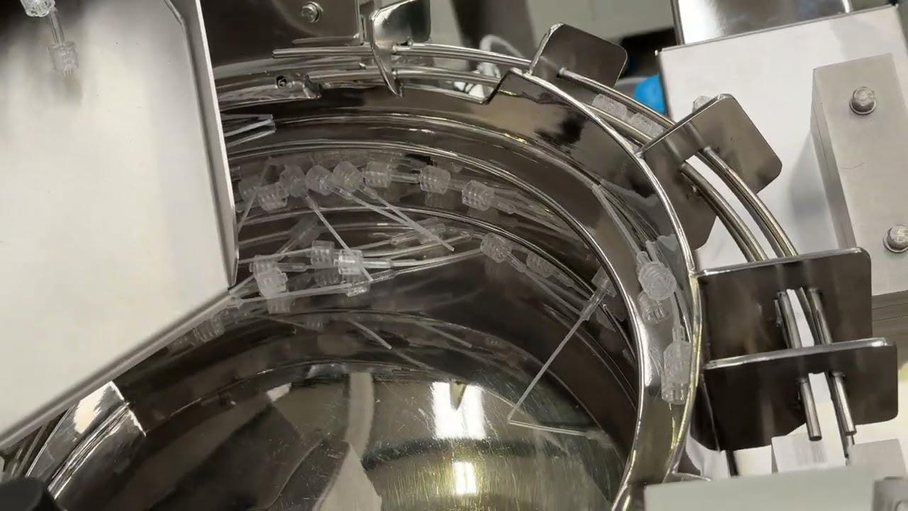 Bowl Feeder feeds and orientates Luer Locks | RNA Automation Ltd