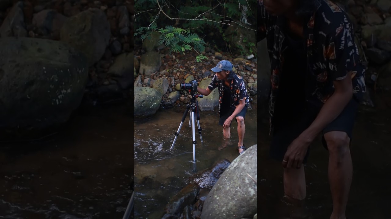 Moto Long Exposure aliran sungai alami di depan tenda 