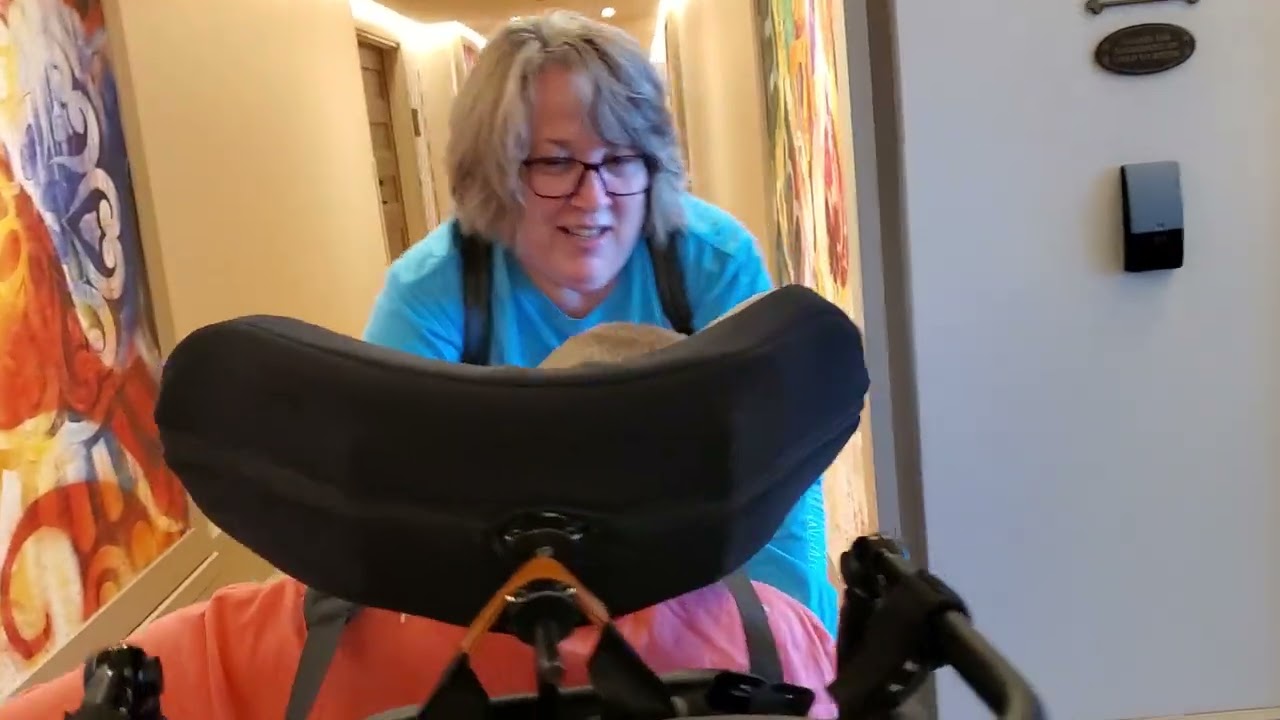 Sam riding elevator in Coronado Springs Resort at Disney World @onthatnote