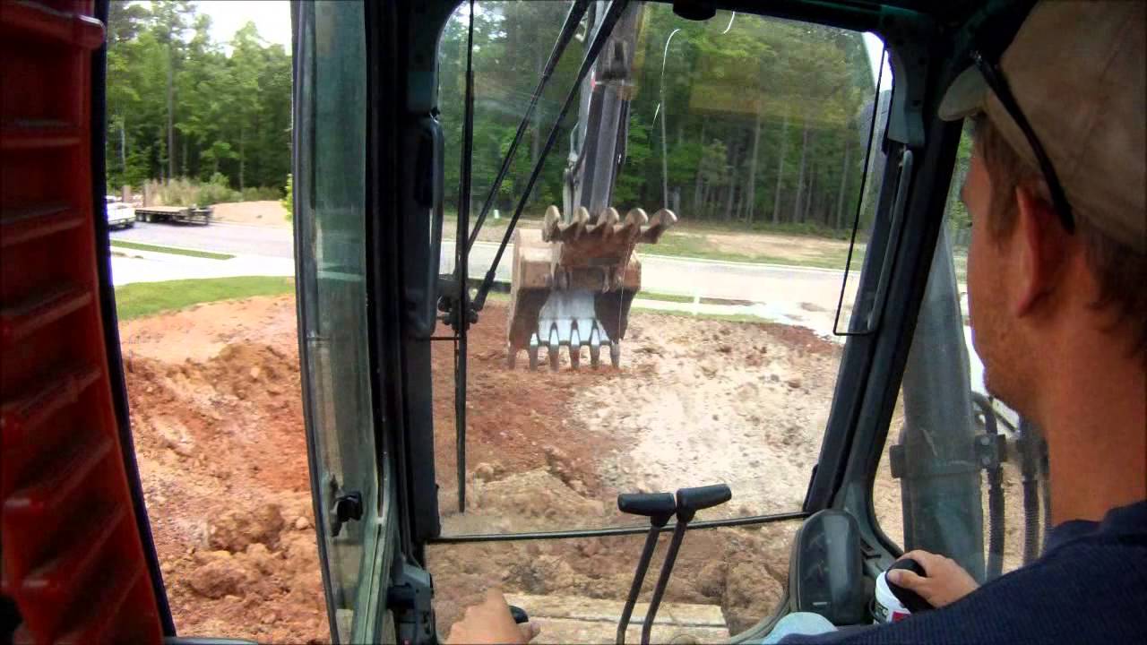 Excavator Loading More Trucks