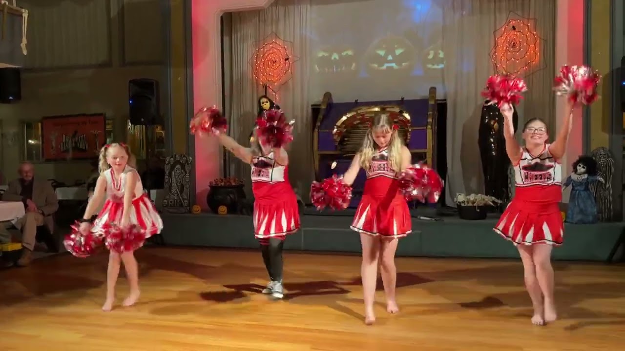 Nova does a cheerleader-routine to “Mickey!”