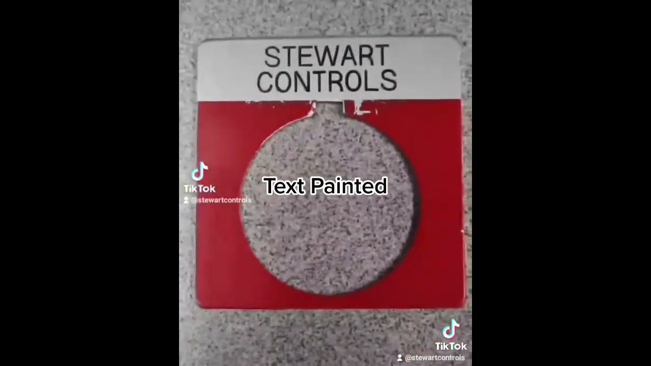 Engraving a 30mm push button legend plate.