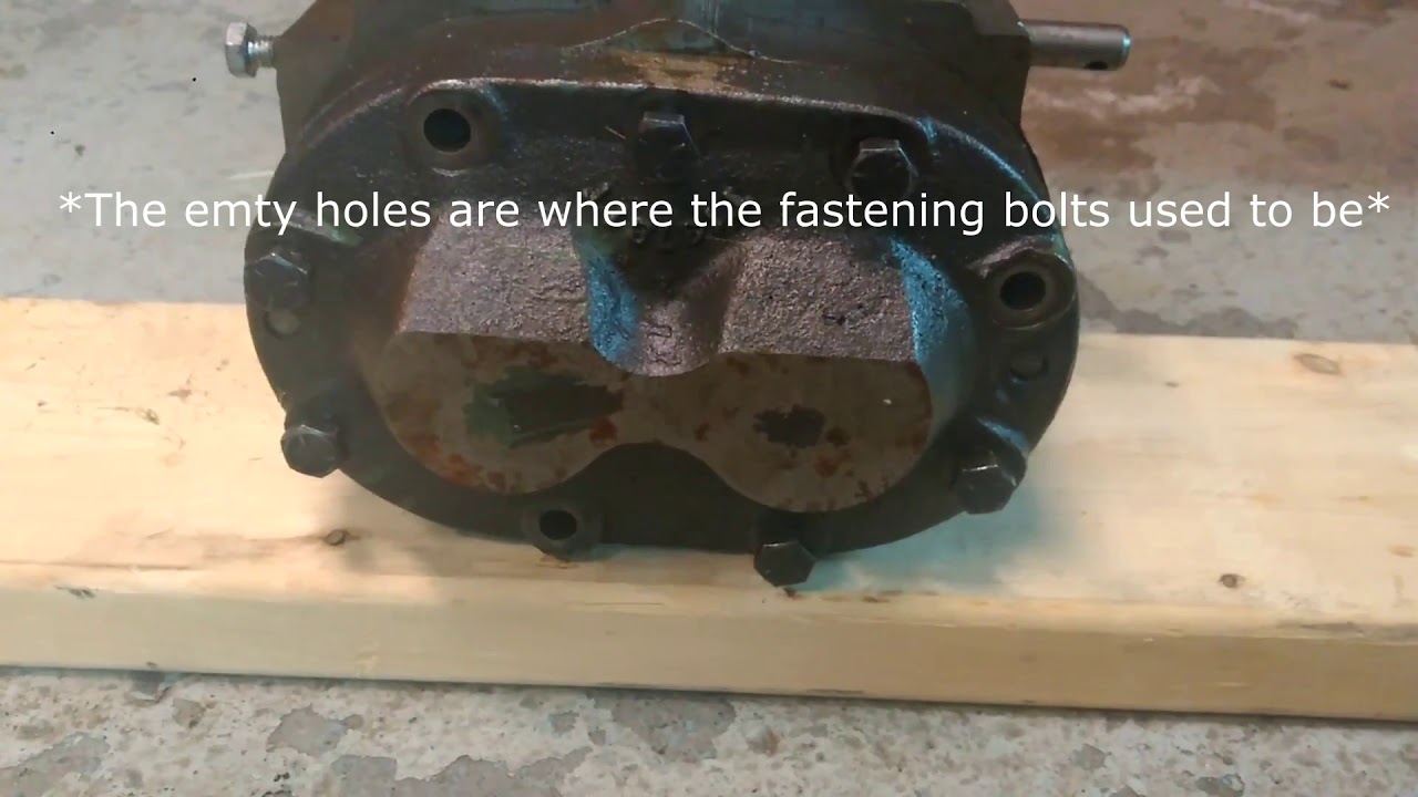 Замена гидравлического насоса John Deere 2010 (обзор)