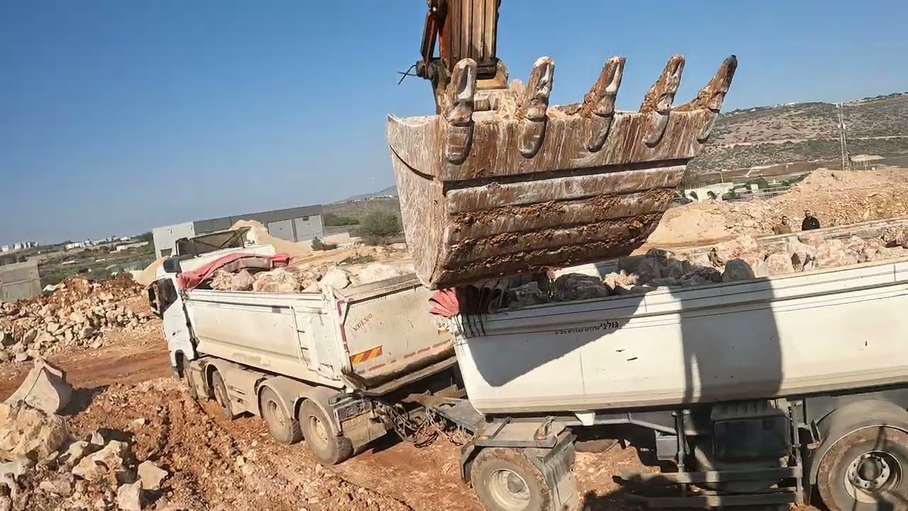 Hitachi 350 Excavator Loading Rocks into a Truck – Precision in Action!