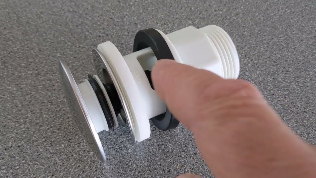 Montering af hansgrohe push open bundventil til håndvask med overløb