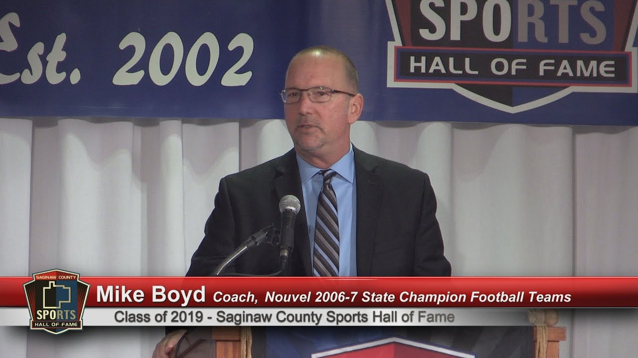 Mike Boyd accepts for the Nouvel Catholic Central 2006 and 2007 State Champion Football Teams