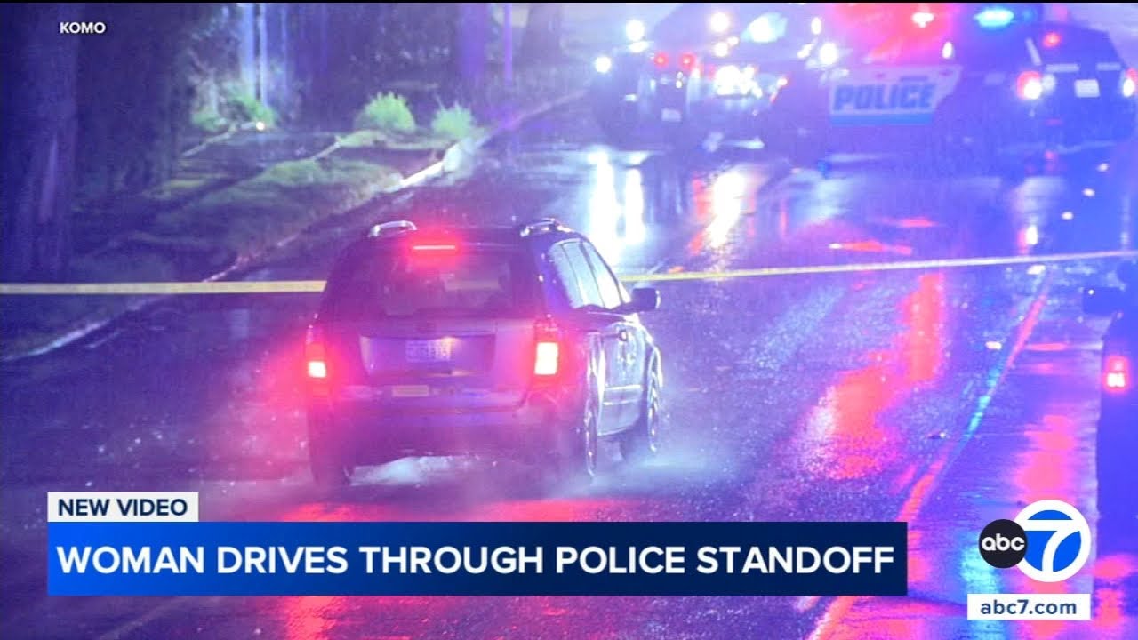 Woman drives through active police scene, nearly hits officer
