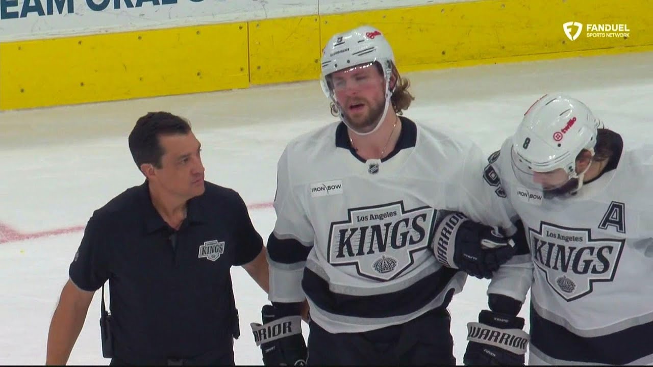 Adrian Kempe goes down awkwardly and is helped to the bench.