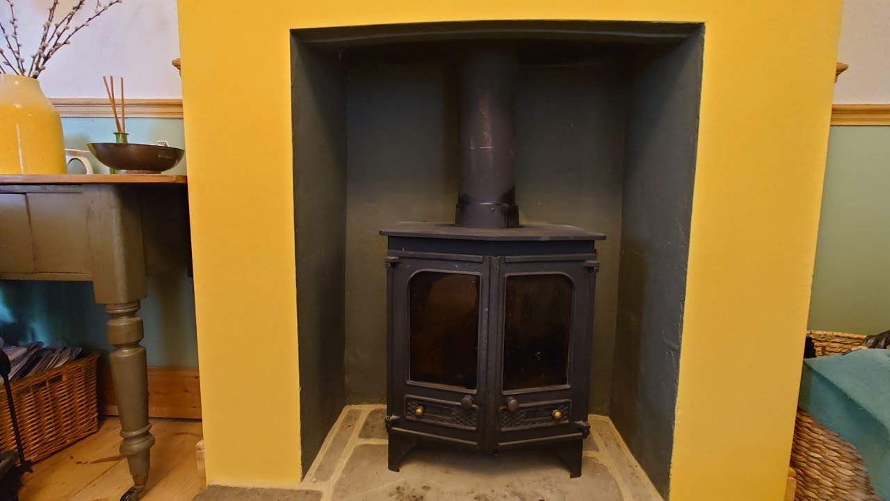 SWEEPING AND REPAIRING A CHARNWOOD COUNTRY 12 WOOD STOVE.