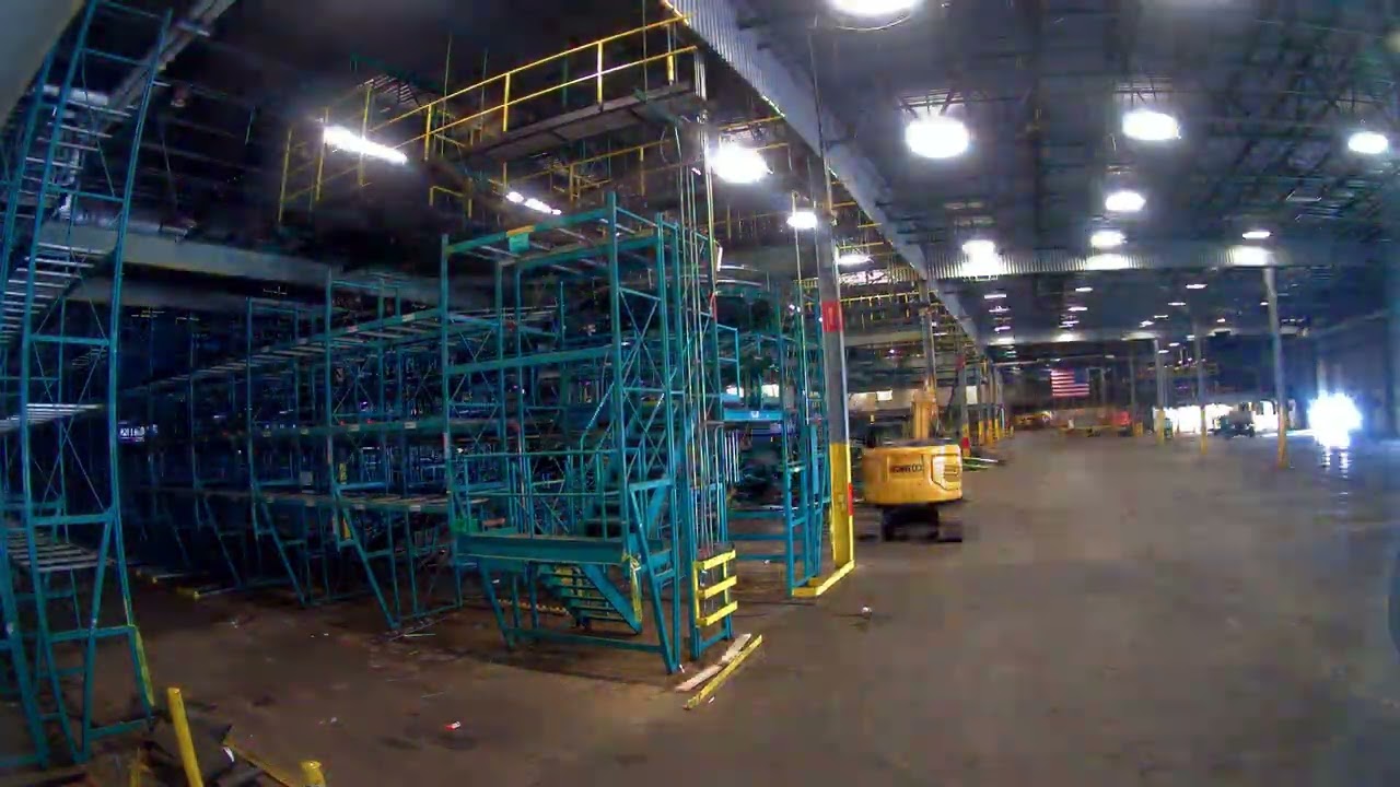 Interior demolition of metal racks, conveyors, and steel support systems.