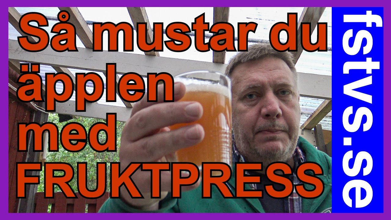Musta &auml;pplen med fruktpress
