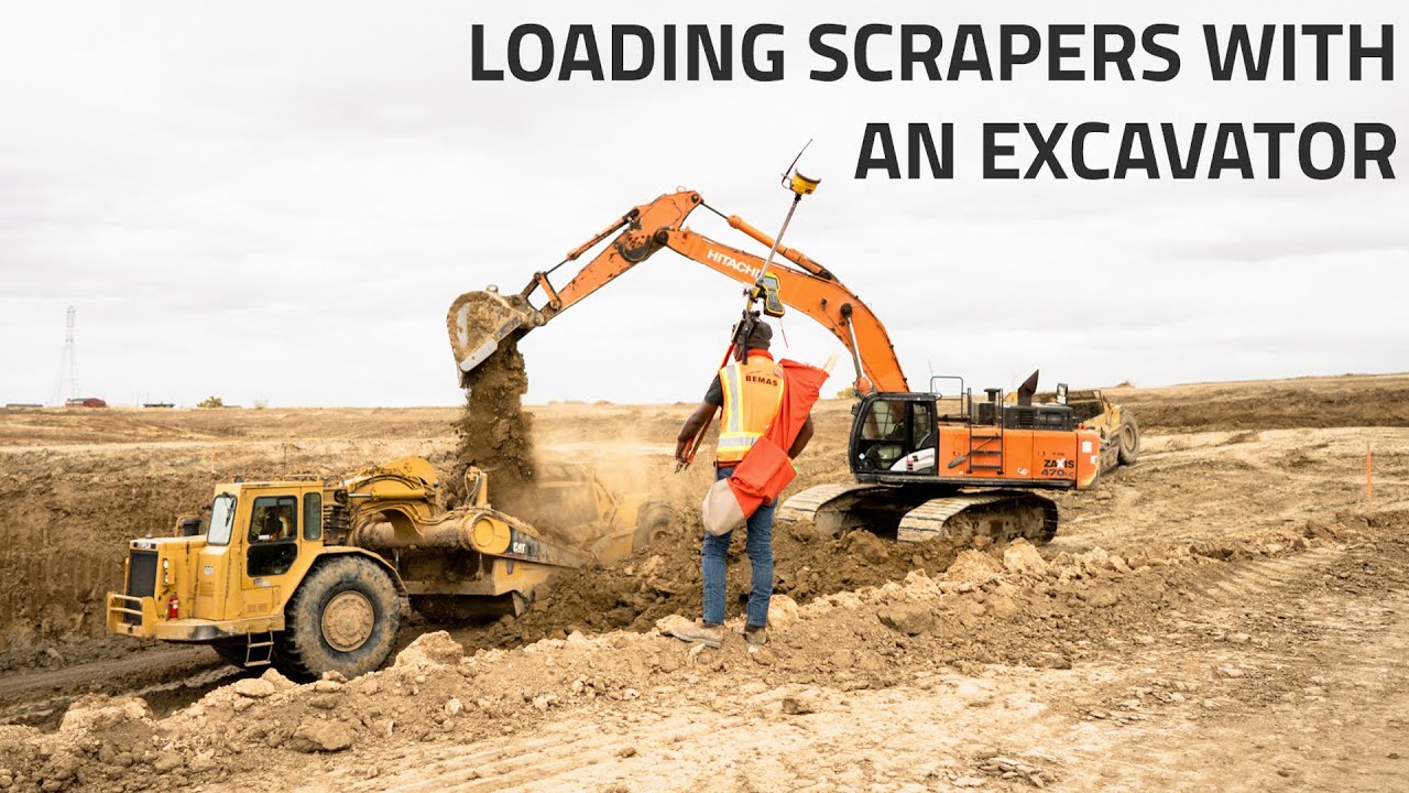Loading CAT Scrapers with an Excavator