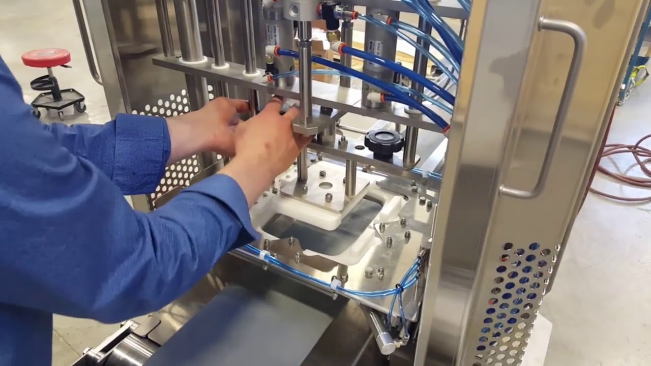 Automated Lid Closing Equipment for Hinged Lid Clamshells  June 28, 2020