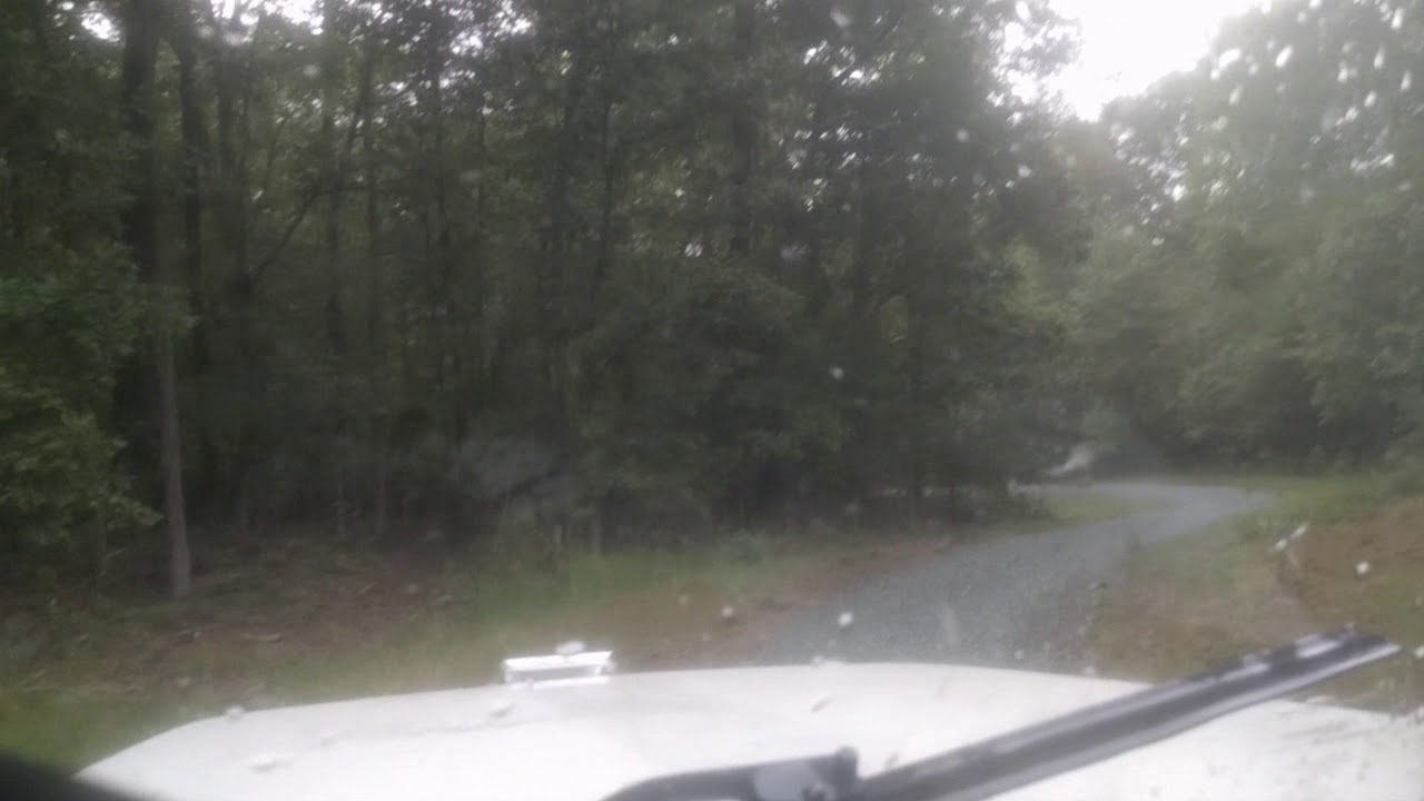 Tailgate spreading #67 stone on a service road