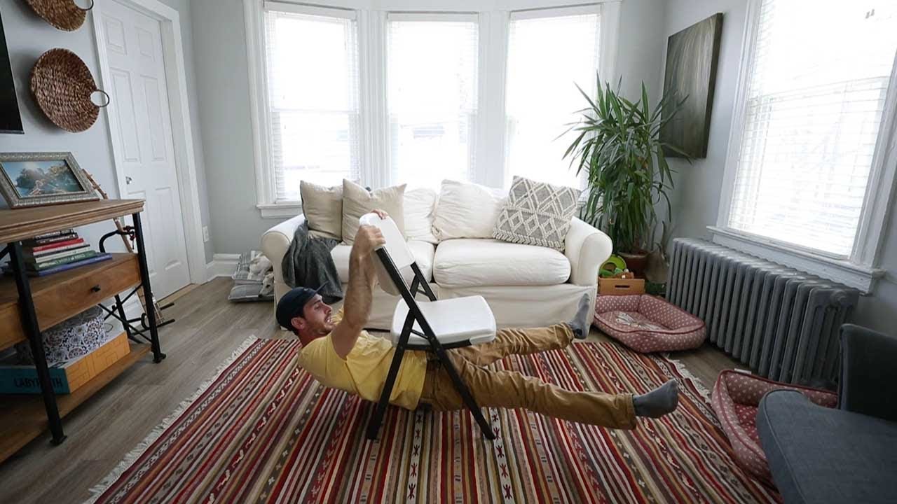 Man Practises Climbing Using Furniture