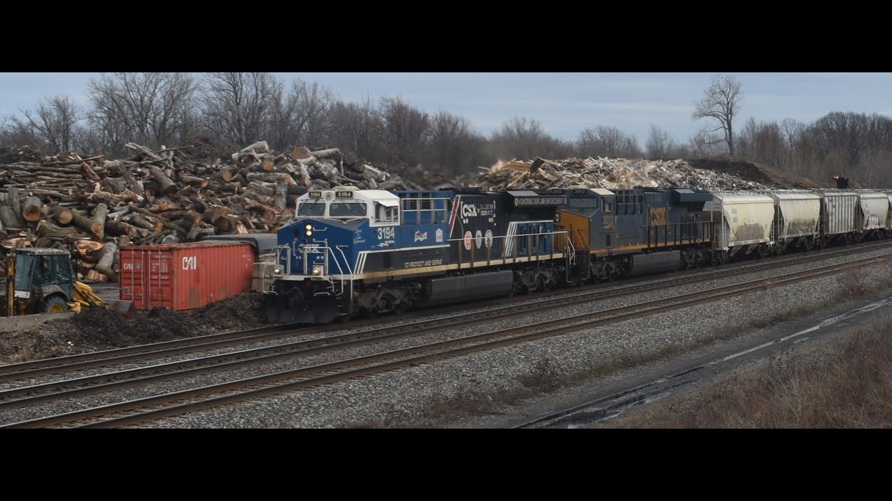 CSX action around Lackawanna with CSX 3194 Law Enforcement unit leading a massive extra manifest