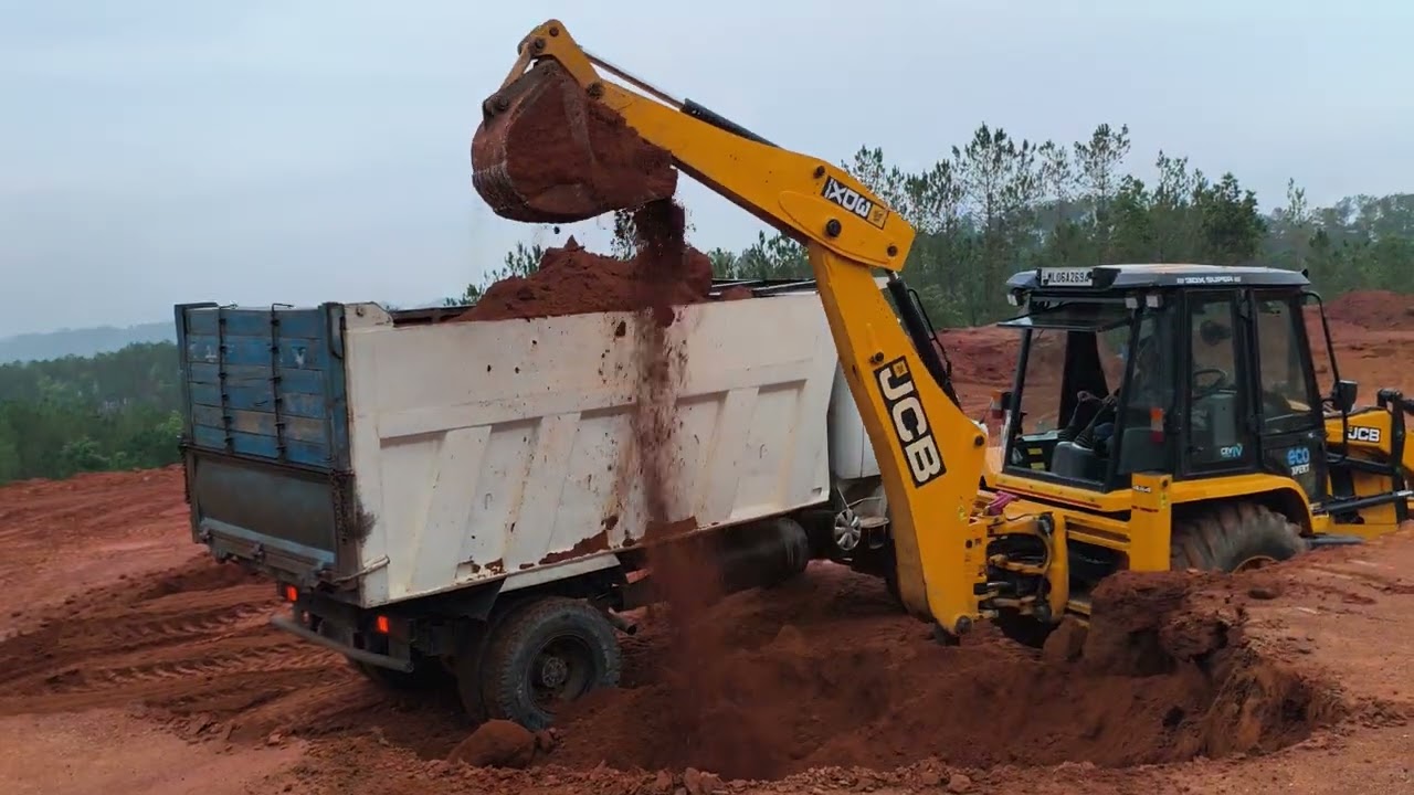 jcb || jcb digging and loading soil into a dump truck (dumper truck)