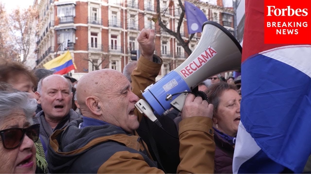 Protesters Gather En Masse In Spain After U.S. Military Actions Against Venezuela