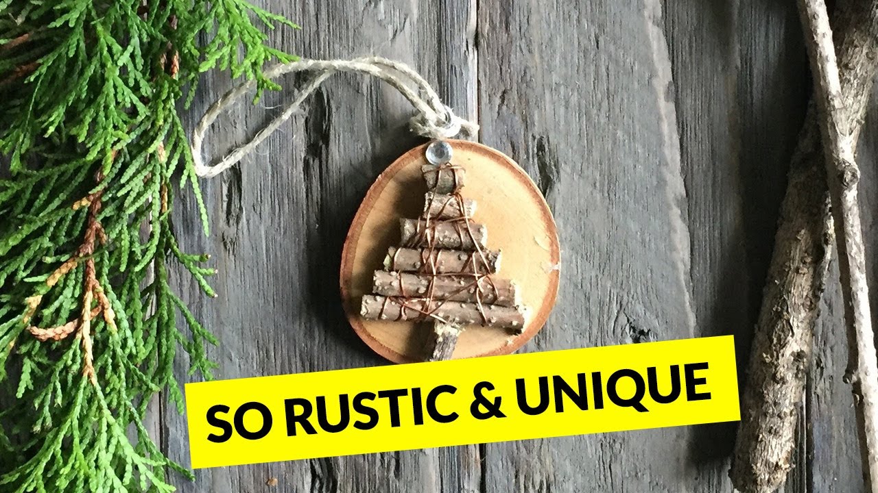 Rustic copper-wrapped Christmas tree ornament on a birch wood slice