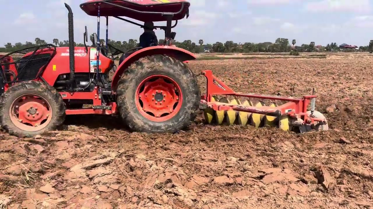 Kubota M6040SU Plowing rice fields