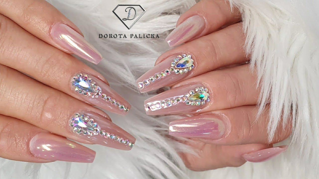 Chrome nails with a bling. Aurora chrime pigment applications with Swarovski crystals placement