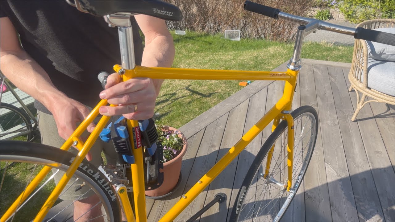 Tinkering with the yellow bicycle