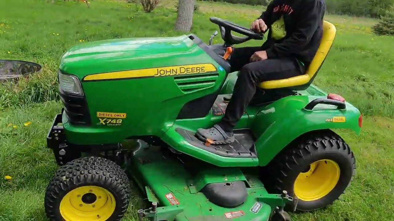 moving tall grass with the x748 garden tractor for the first time