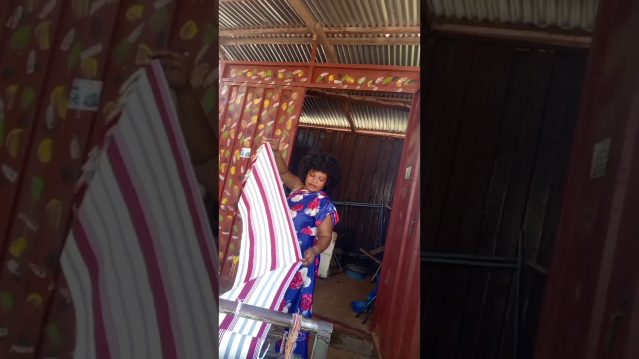 removing the completed fabric from the loom. #explore #highlights #weaving #weavingfabric#ghanamade
