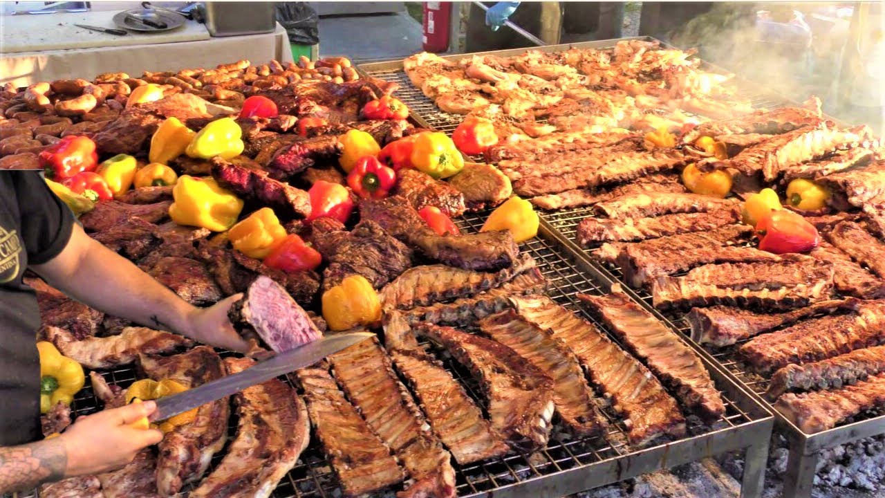 Street Food in Italy. Grilled Meat from Argentina, Asado, Sausages, Ribs, Pork Legs, Veal Steaks