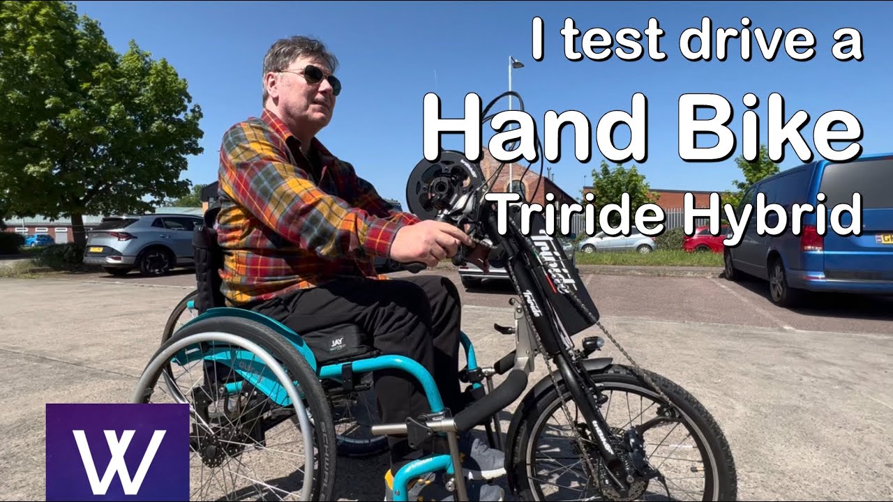 I test drive a hand bike hybrid power Triride wheelchair front wheel attachment