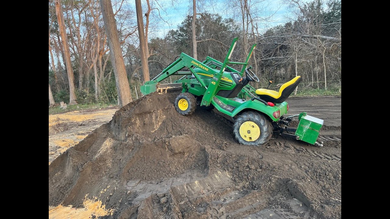 Moving dirt with the 45 Loader John Deere X495