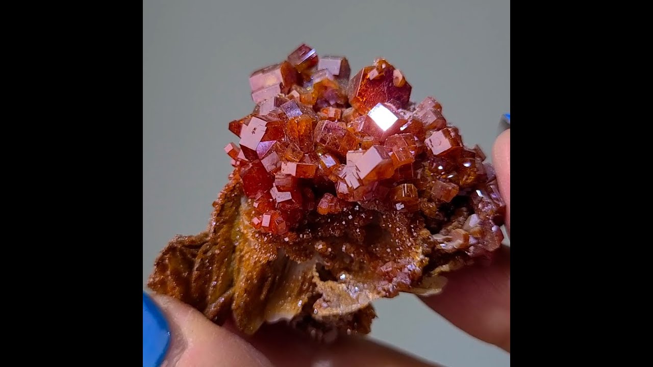 Vanadinite on barite cluster from Morocco, featuring gemmy red hexagonal crystals