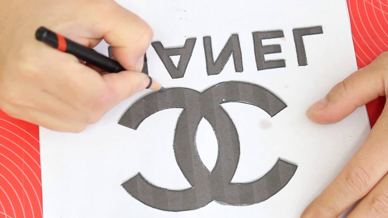 Kricky Cakes Decoration: Chanel logo painted to fondant