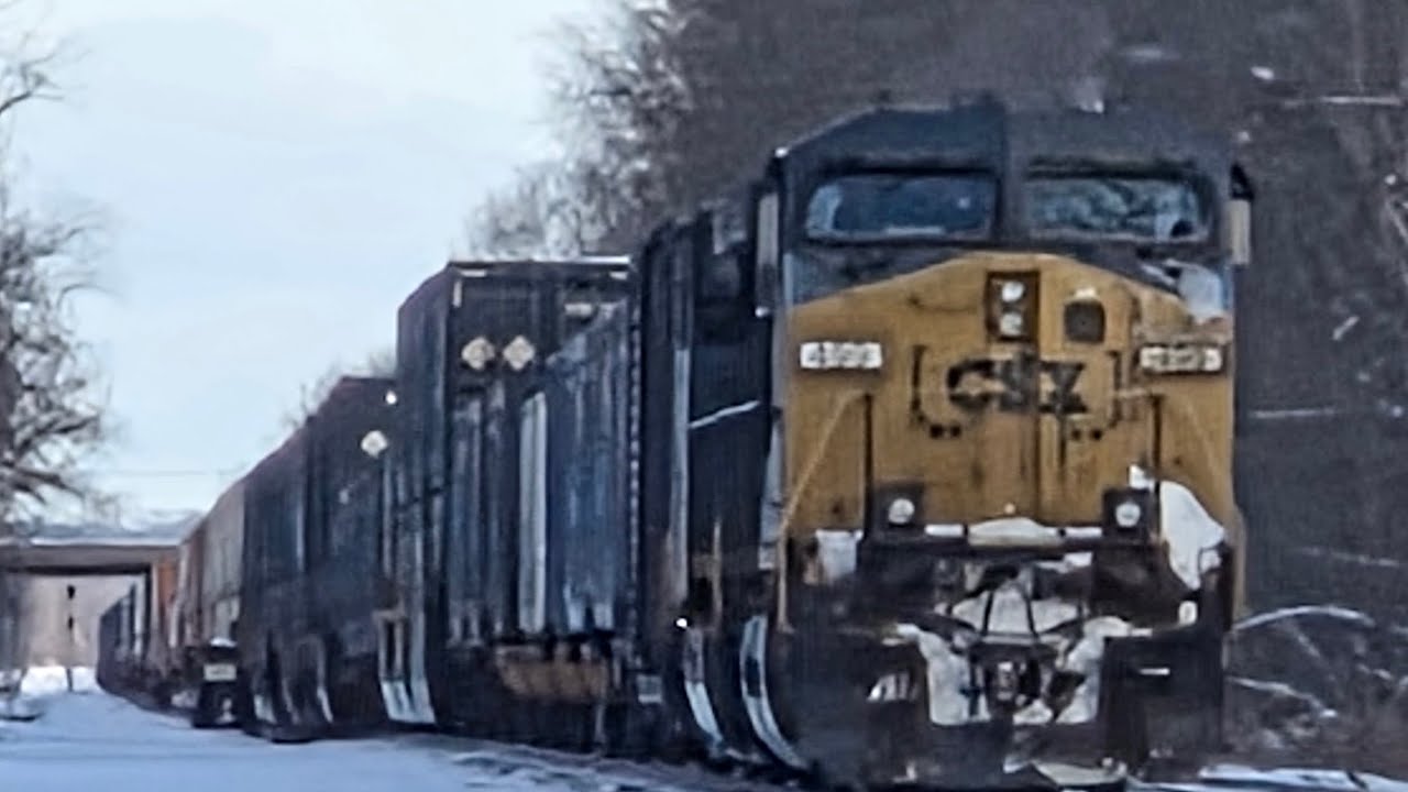 Slow and long CSX intermodal with a Do Not Hump boxcar revs up at Bolivar rd