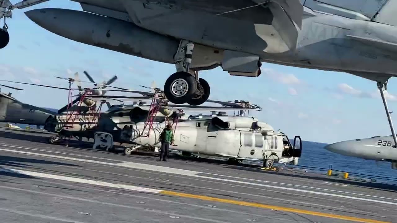 Hooking the tailhook on the steel wire on a USS aircraft carrier