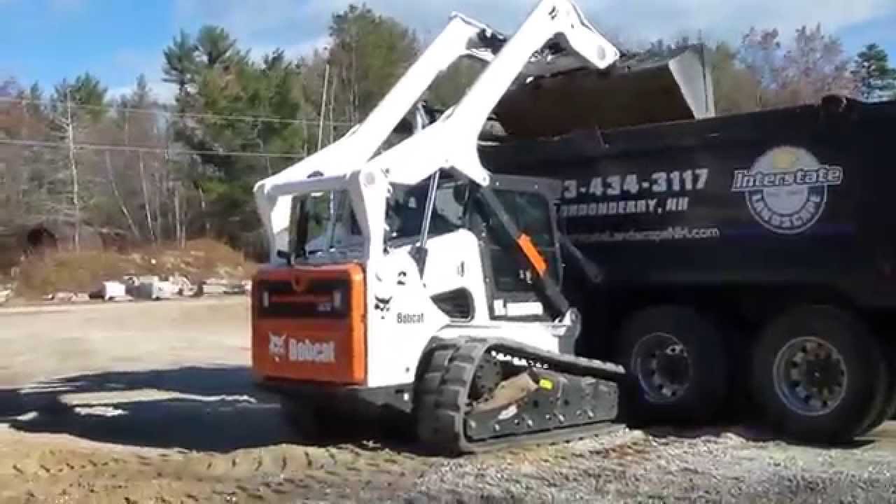 Bobcat T870 Loading Tri Axle Dump Truck