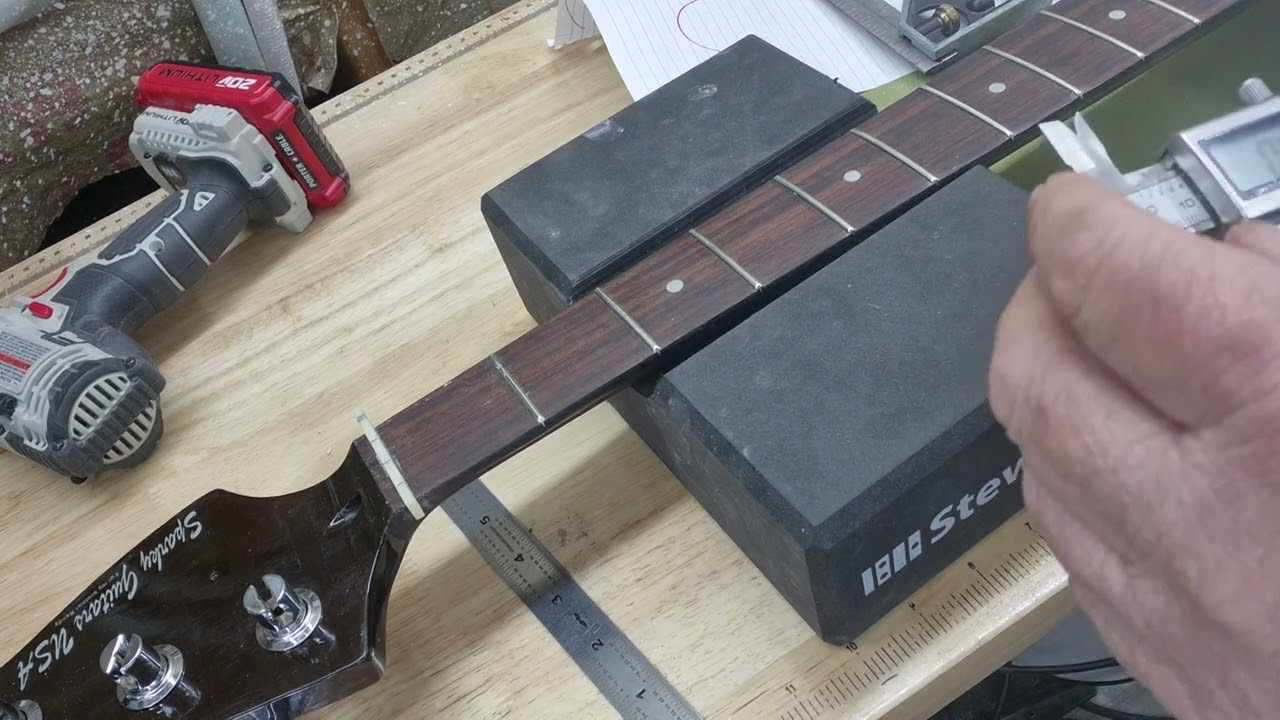 Formula for string spacing and please check out Paul Burris