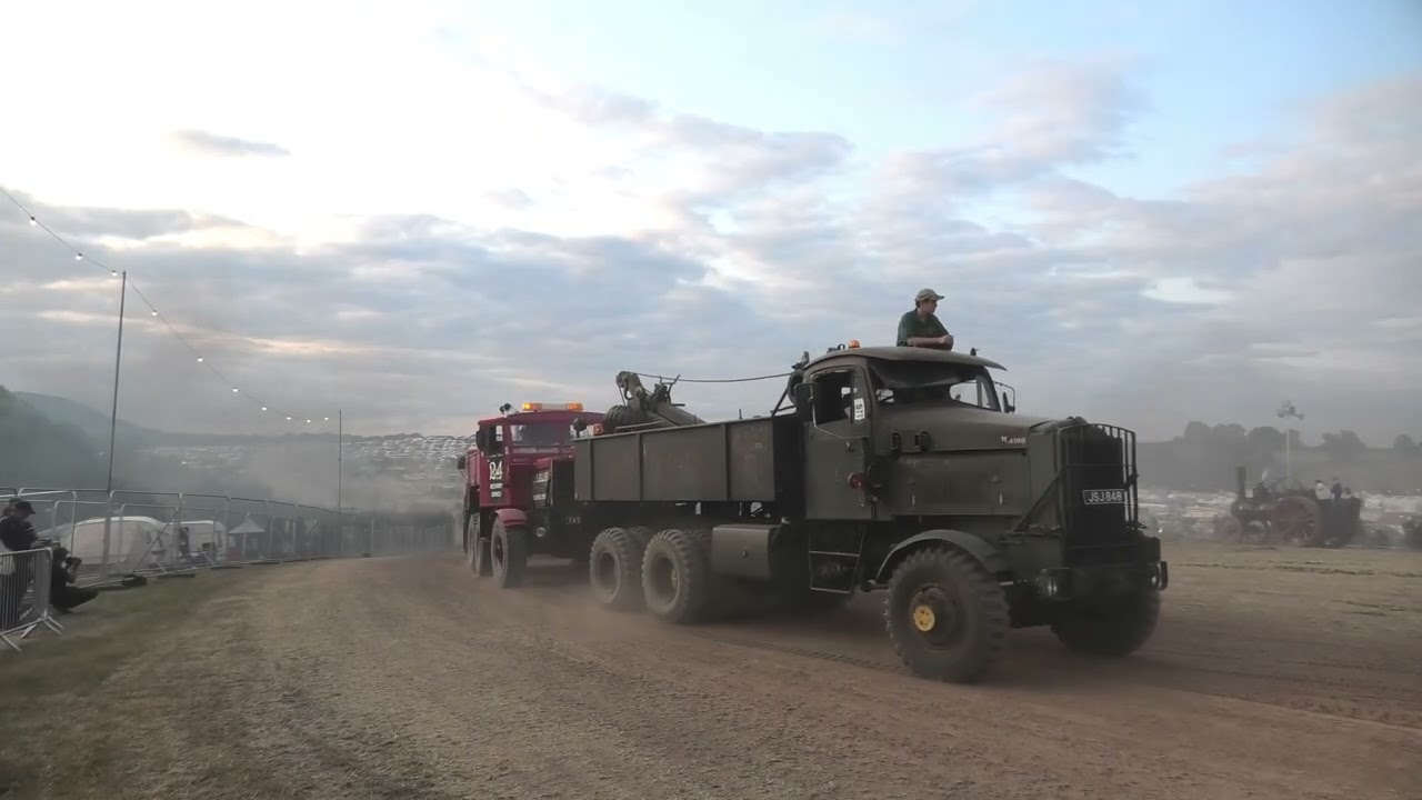 Three Heavy Haulage Trucks move heavy Engine up hill at Welland Steam Rally 