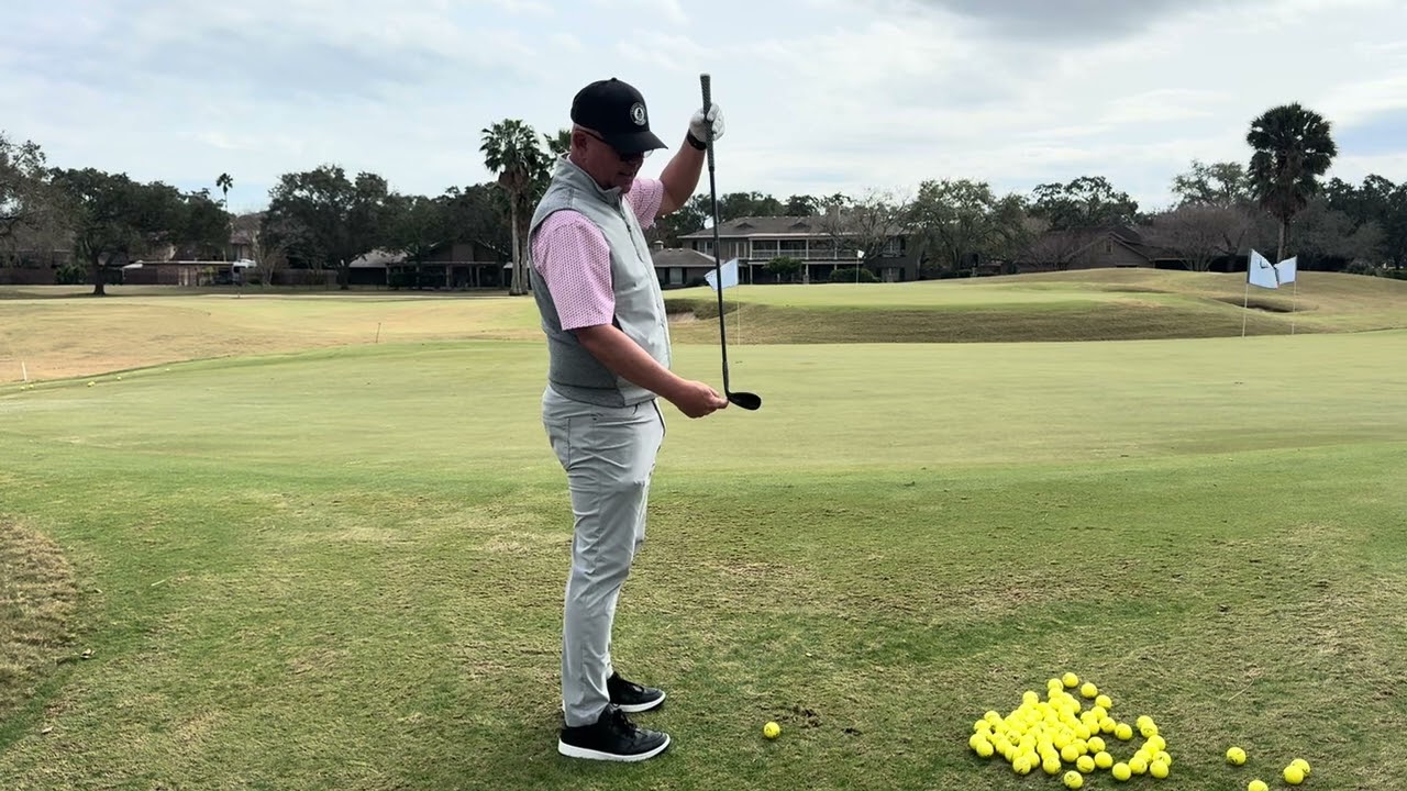 Brent Blackburn takes his hands up, with a pitching wedge