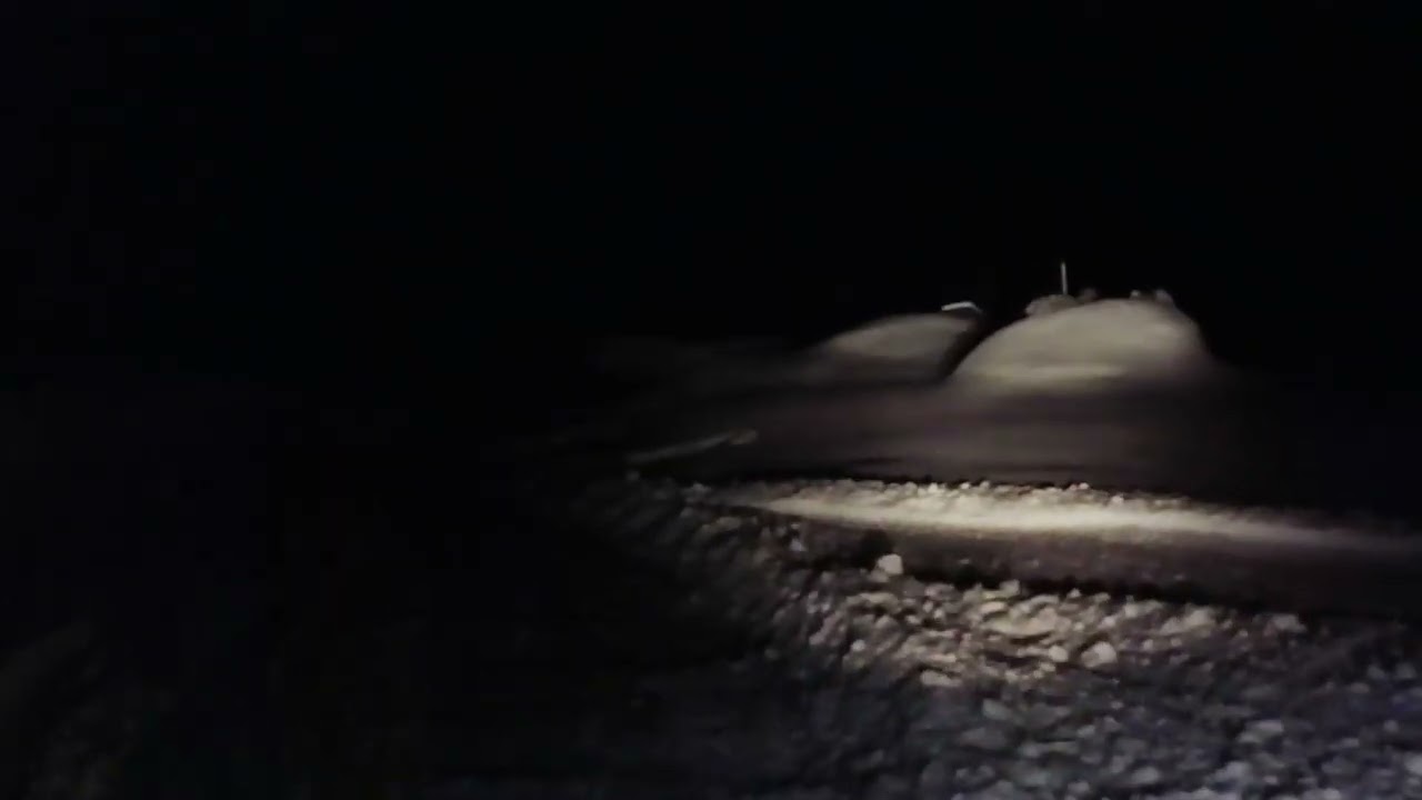Its still snowing Night plowing  with the Hisun Sector Utv