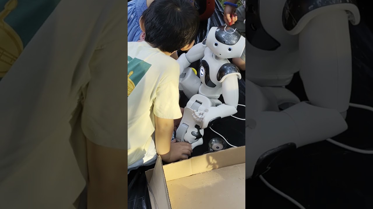 Tesla's 2024 Birthday Celebration - Robot looking at me.