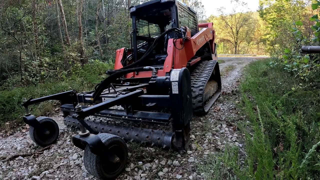 Fixing Washed Out Gravel Drive with Skid Steer Power Rake