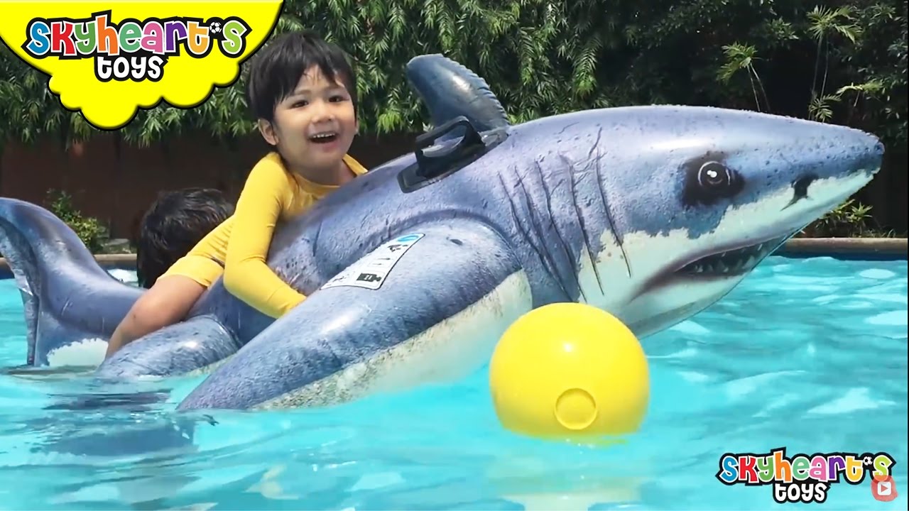 Skyheart rides the GIANT SHARK - swimming toys for kids playtime with inflatables and surprise eggs