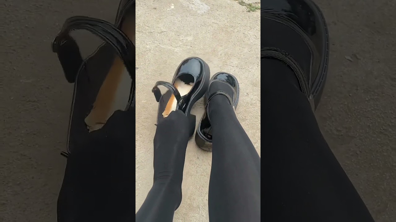 Girl take her black shoes off