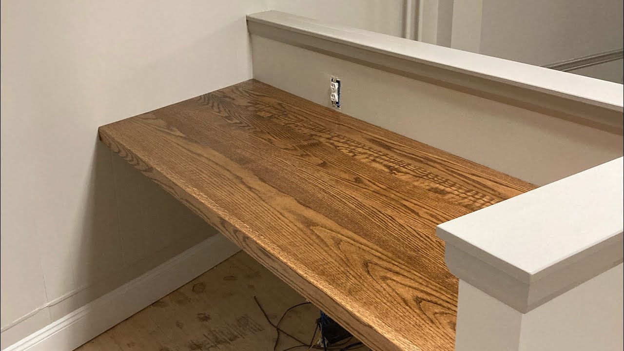 Trim Cap on Half wall and Stained Oak Desktop