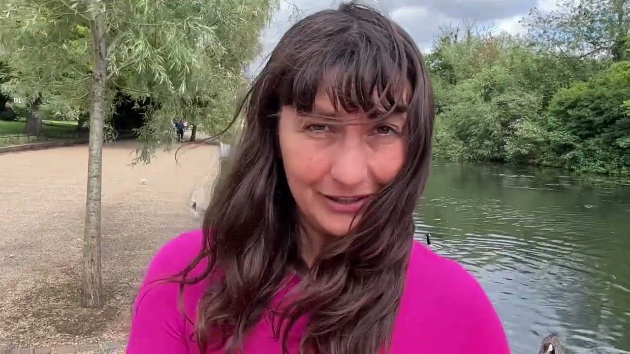 Tsetsi Feeding Wild Canadian Geese on river Thames, UK